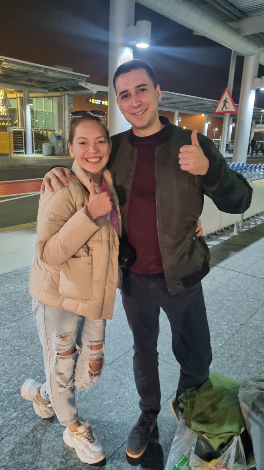 Happy couple at airport